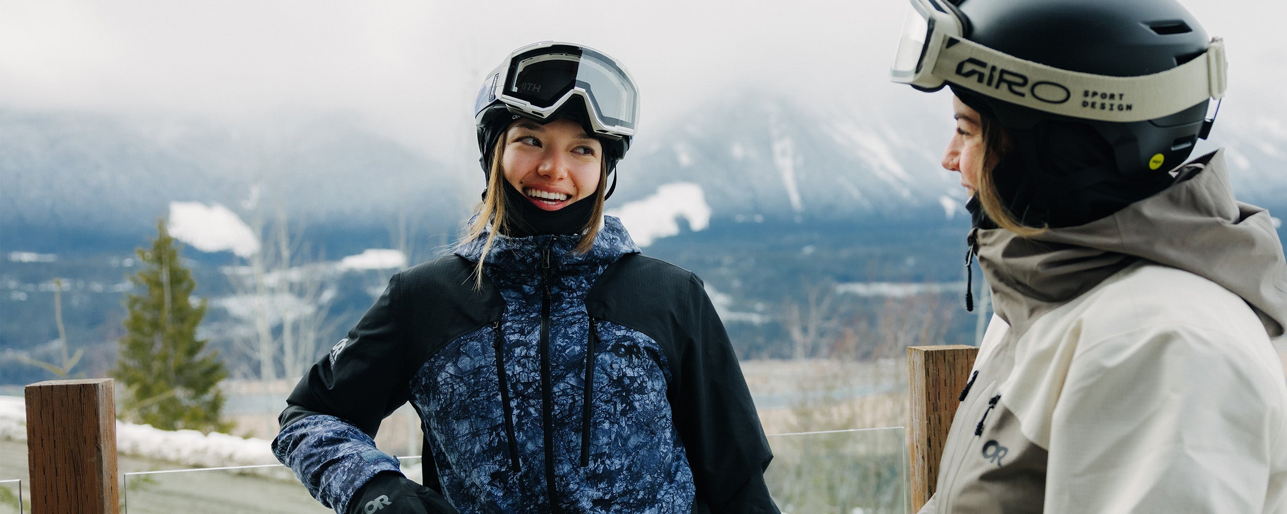 Person in winter clothing with a mountainous background.